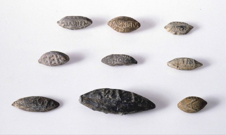 Inscribed slingshot projectiles