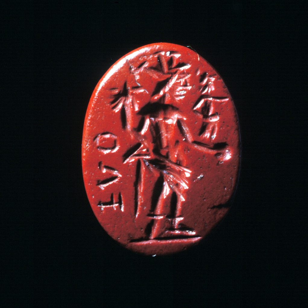 Flat oval gemstone with depiction of Jupiter with patera and Nike and the inscription FLO